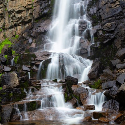 Waterfall cascading over mossy rocks