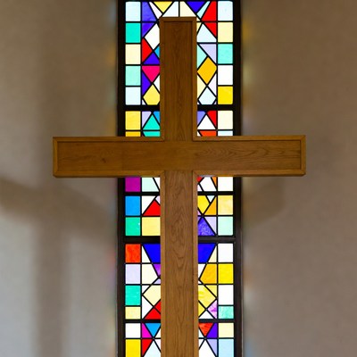 Wooden Cross Before Stained Glass Window