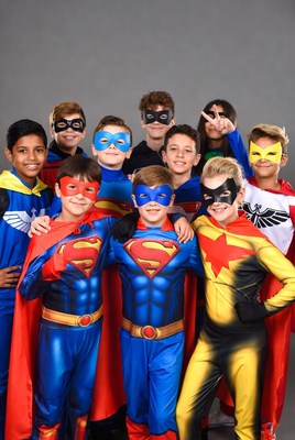 Group of kids in superhero costumes