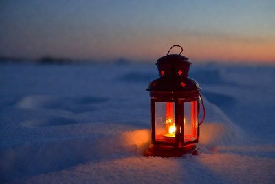 Red Lantern Glowing in Snow