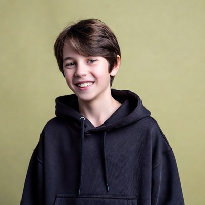 Smiling boy in black hoodie