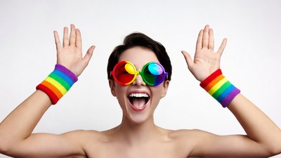 Woman wearing rainbow sunglasses and wristbands
