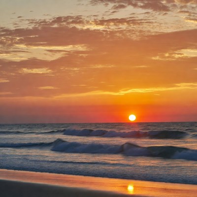 Sunset over ocean waves