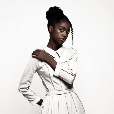 African-American woman in white dress
