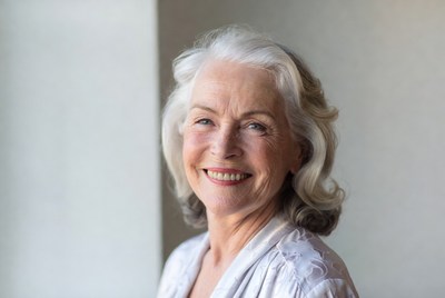 Smiling elderly woman with silver hair