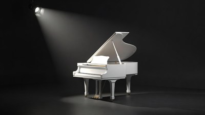 White grand piano under spotlight
