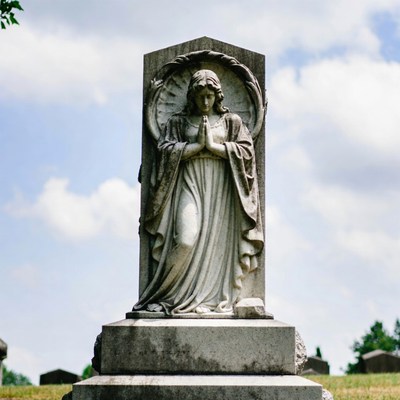 Praying Angel Statue on Gravestone
