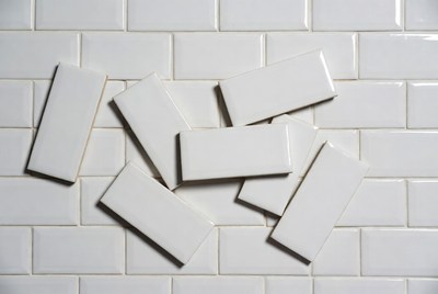 White subway tiles scattered on wall