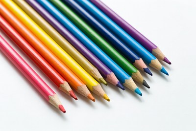 Colorful pencils arranged in rainbow