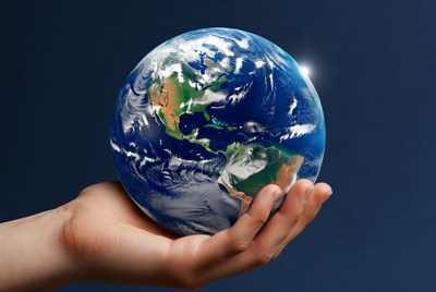 Hand holding Earth globe