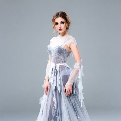 Woman in sheer lace gown