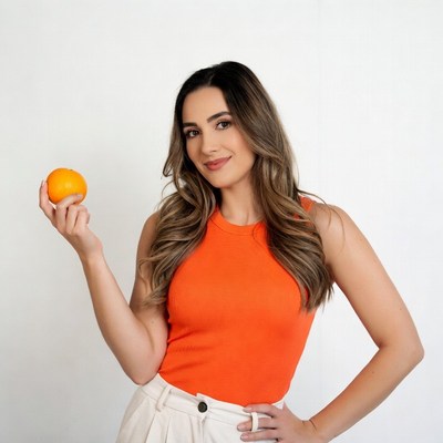 Woman holding orange fruit