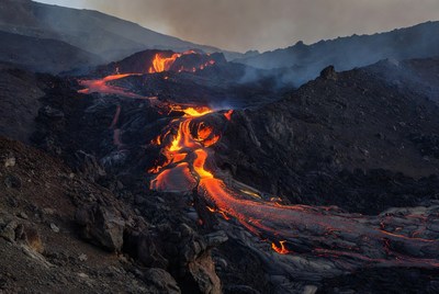 Glowing Lava Flow on Volcanic Mountain