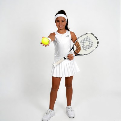 Young girl holding tennis racket and ball