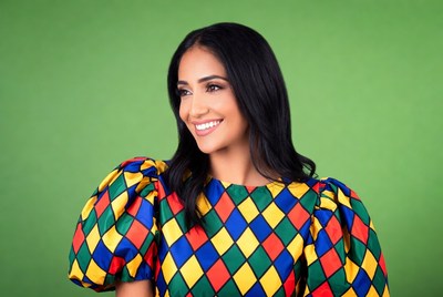 Woman in colorful harlequin dress smiling