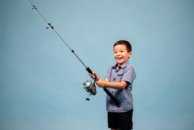 Asian boy holding fishing rod