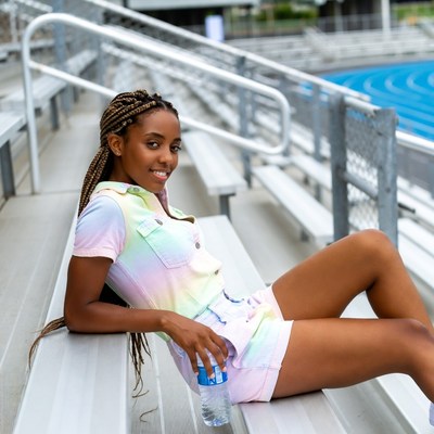 African-American woman on stadium bleachers