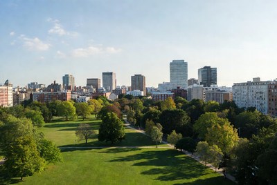 City skyline over green park