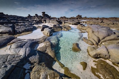 Turquoise Pool in Rocky Coastal Landscape