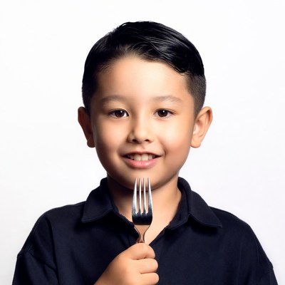 Asian boy holding fork