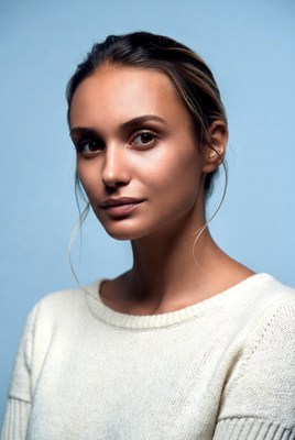 Woman with ponytail on blue background