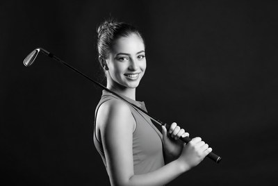Woman holding golf club