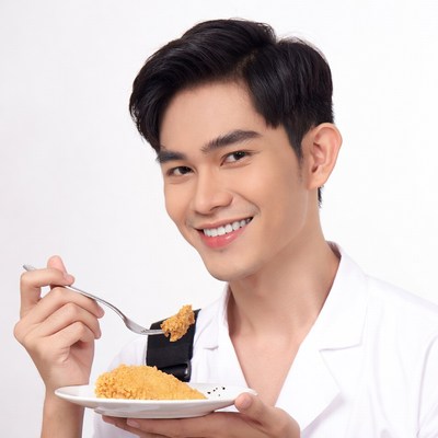 Asian man eating fried chicken