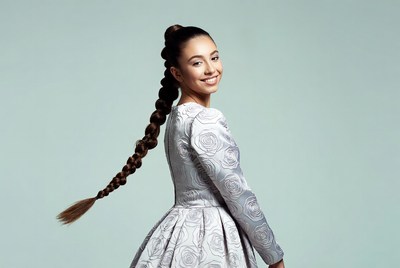 Asian woman with long braid in rose dress