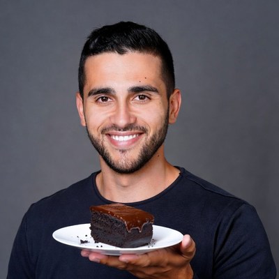 Man holding chocolate cake