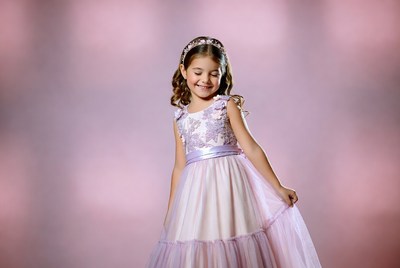 Smiling girl in pink layered dress