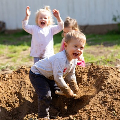 Children playing in dirt pile