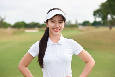 Asian woman golfer on green