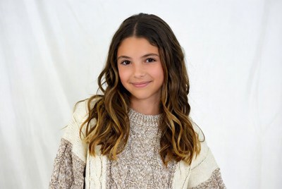 Smiling girl in knit sweater