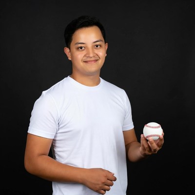 Asian man holding baseball