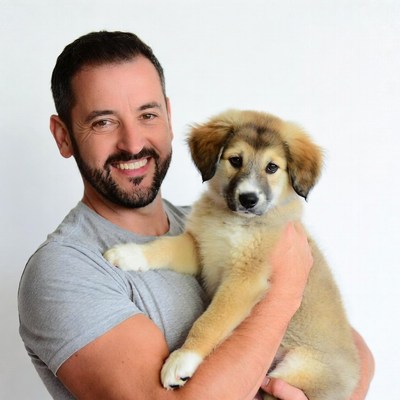 Man holding cute puppy