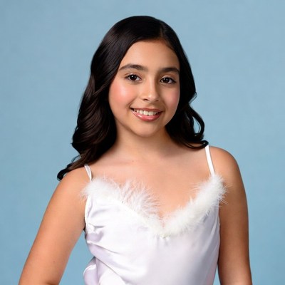 Latina girl smiling in feathered dress