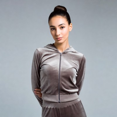 Woman in gray velvet tracksuit