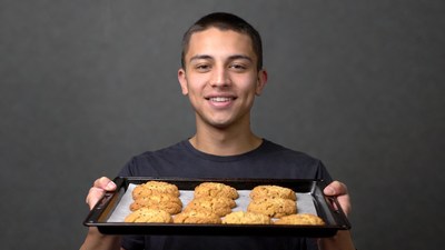 Boy holding tray of cookies