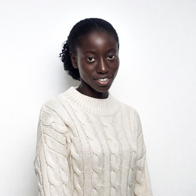 African-American woman in white sweater