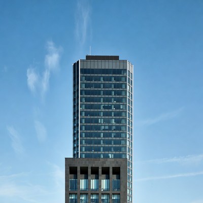 Modern Tall Skyscraper Against Blue Sky