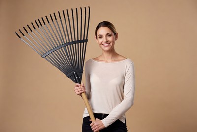 Woman holding black rake