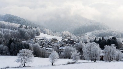 Snowy Village in Winter Mountains