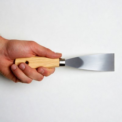 Hand Holding Putty Knife