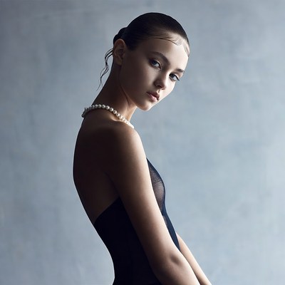 Young woman in sheer black dress