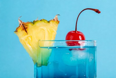 Blue drink with pineapple and cherry