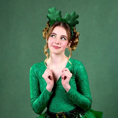 Girl in green shamrock headband