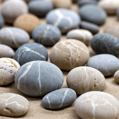 Colorful Pebbles on Sandy Beach