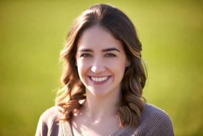 Smiling woman in green field