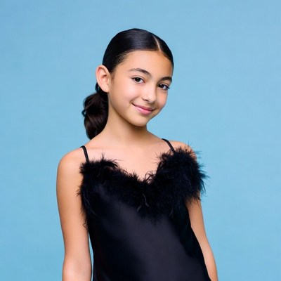 Smiling girl in black feathered dress