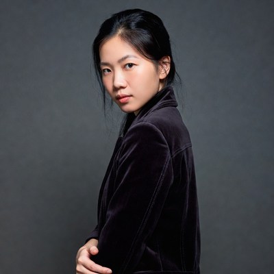 Asian woman in velvet blazer